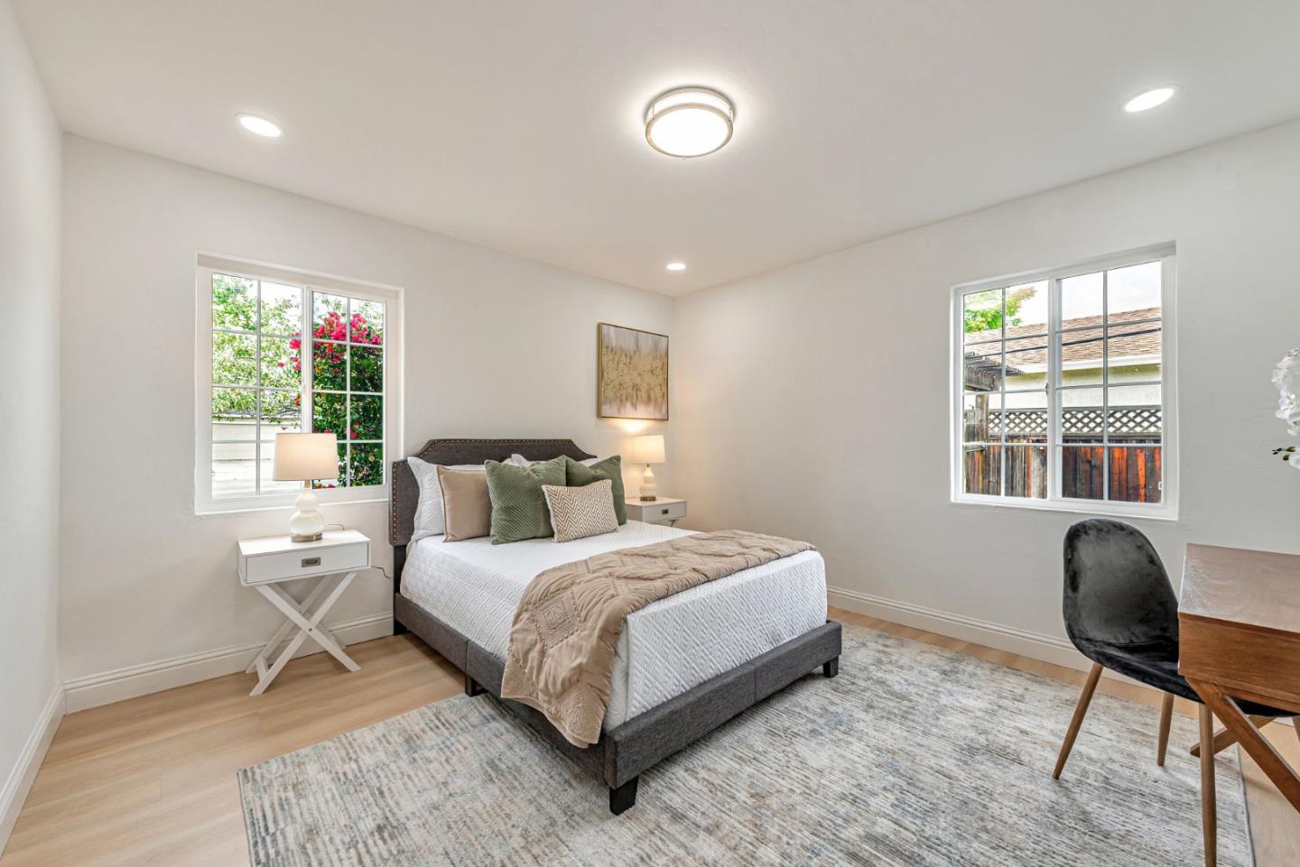 3972 Pepper Tree Lane San Jose, CA 95127 - Photo 32 of 59 a bedroom with a large bed and a chair