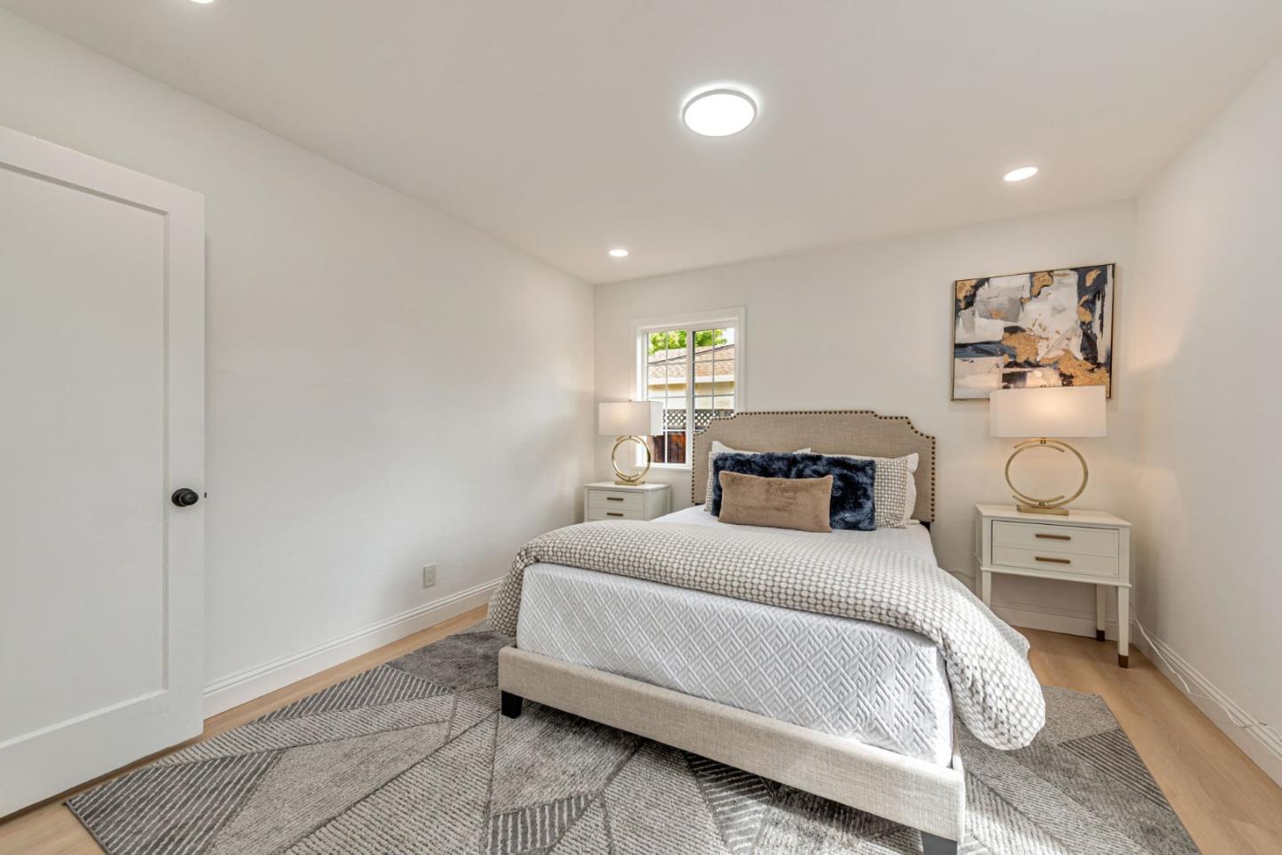 3972 Pepper Tree Lane San Jose, CA 95127 - Photo 37 of 59 a bedroom with a bed and a window