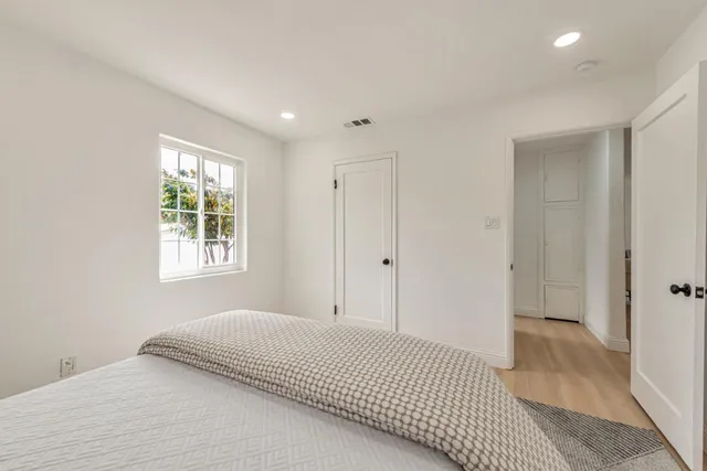 a bathroom with a toilet a sink and a mirror