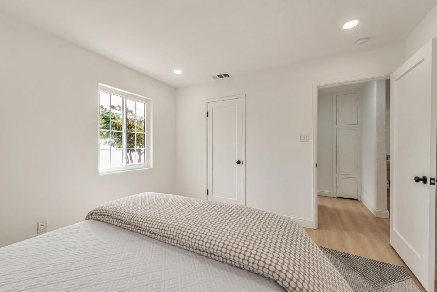 3972 Pepper Tree Lane San Jose, CA 95127 - Photo 39 of 59 a bedroom with a bed and a window