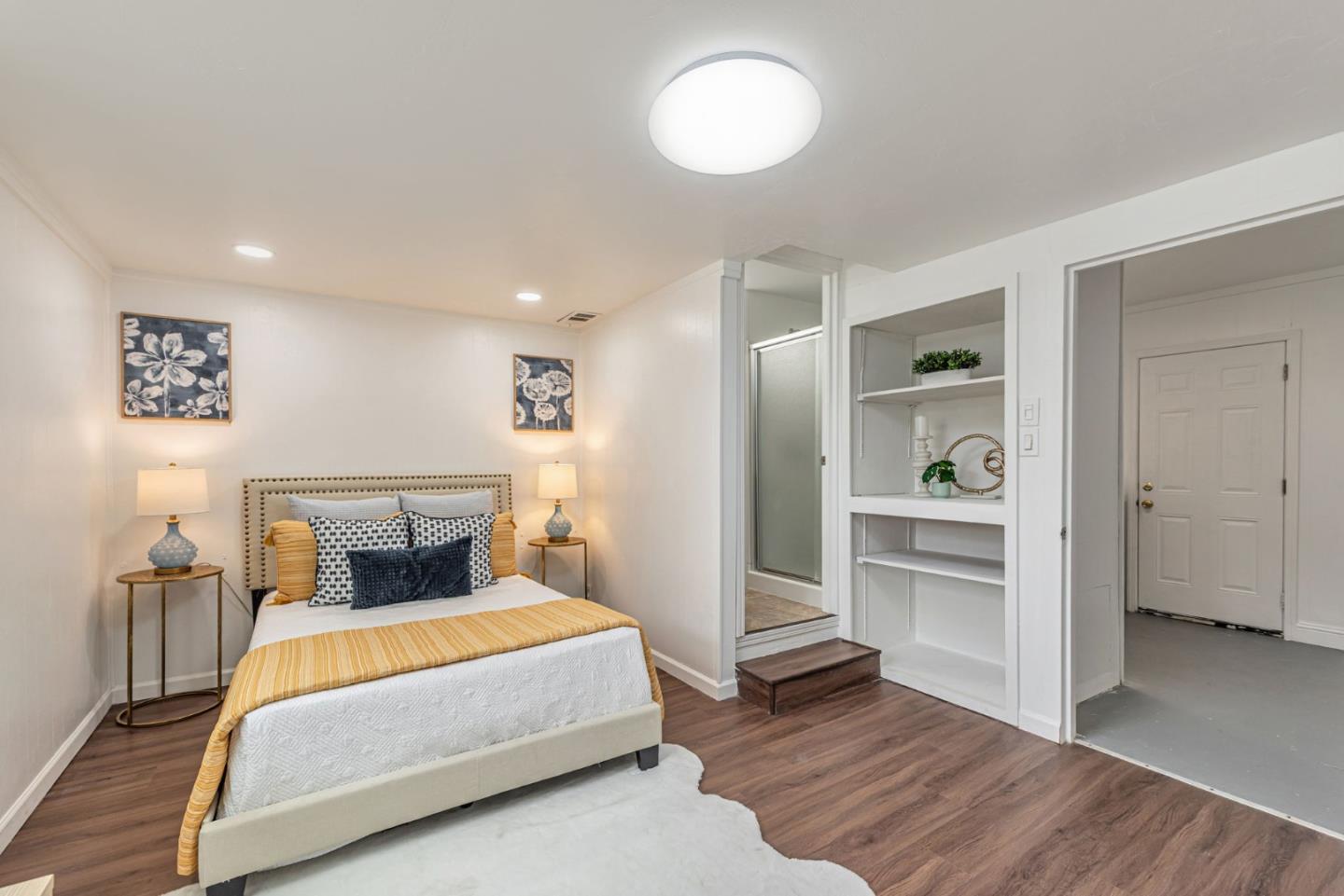 3972 Pepper Tree Lane San Jose, CA 95127 - Photo 41 of 59 a bed room with a bed and a view of kitchen