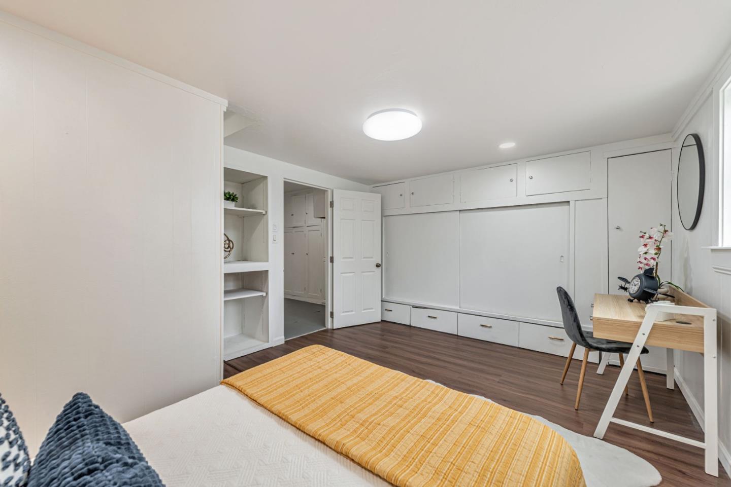 3972 Pepper Tree Lane San Jose, CA 95127 - Photo 43 of 59 a bedroom with a bed and a chair