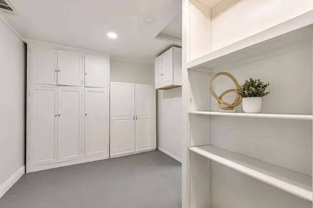 a view of a house with a yard and tree