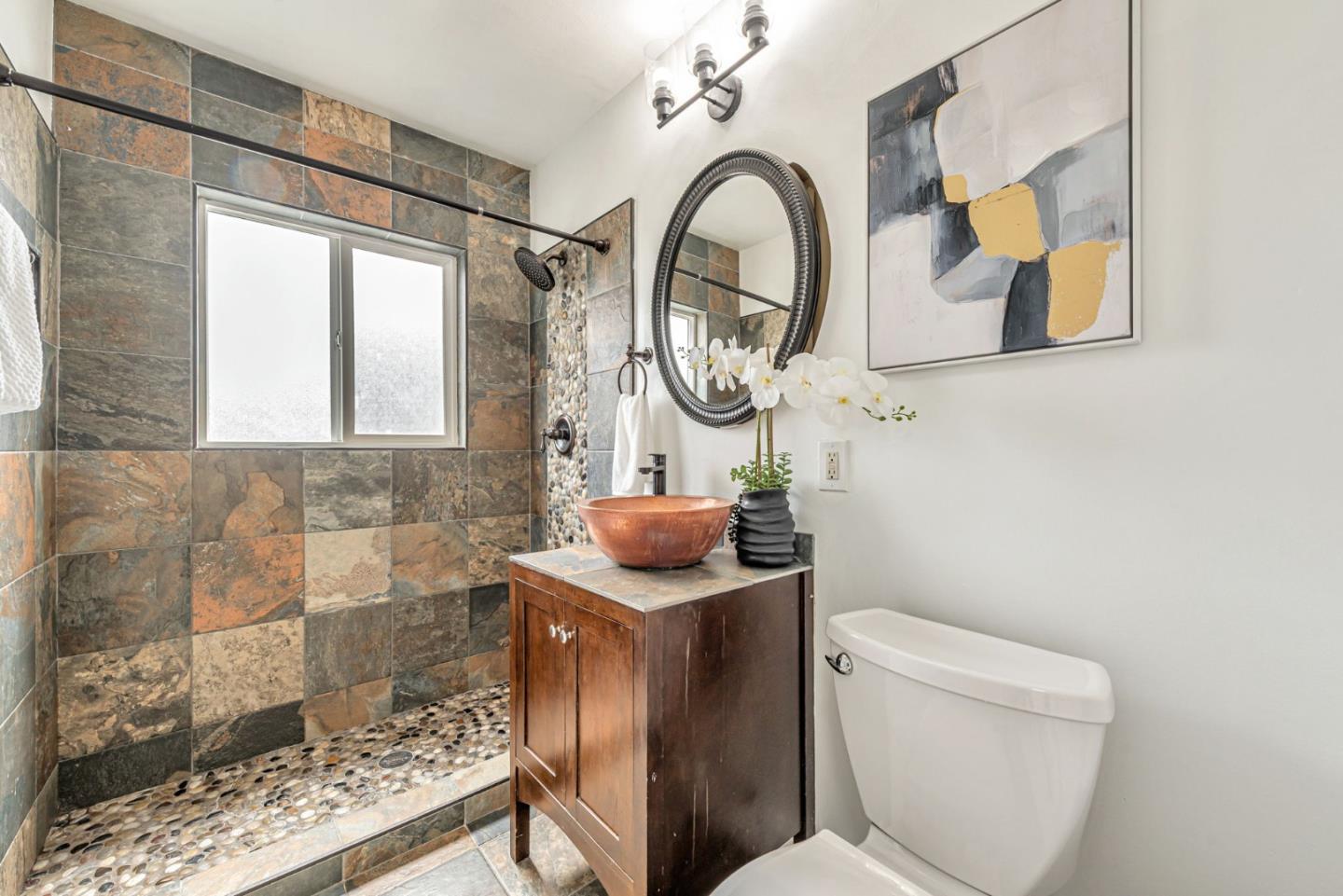 3972 Pepper Tree Lane San Jose, CA 95127 - Photo 45 of 59 a bathroom with a toilet a sink and a mirror