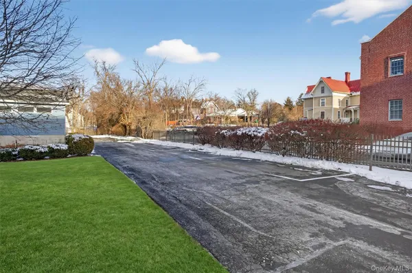 a view of a street with a building in the background