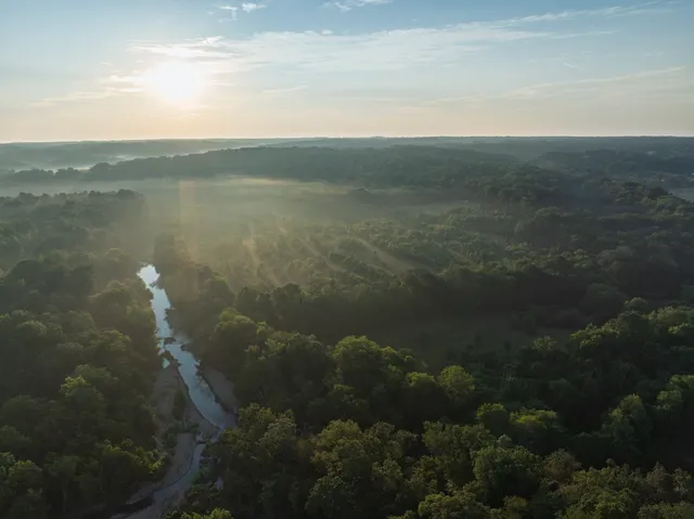 a view of a field with an outdoor space