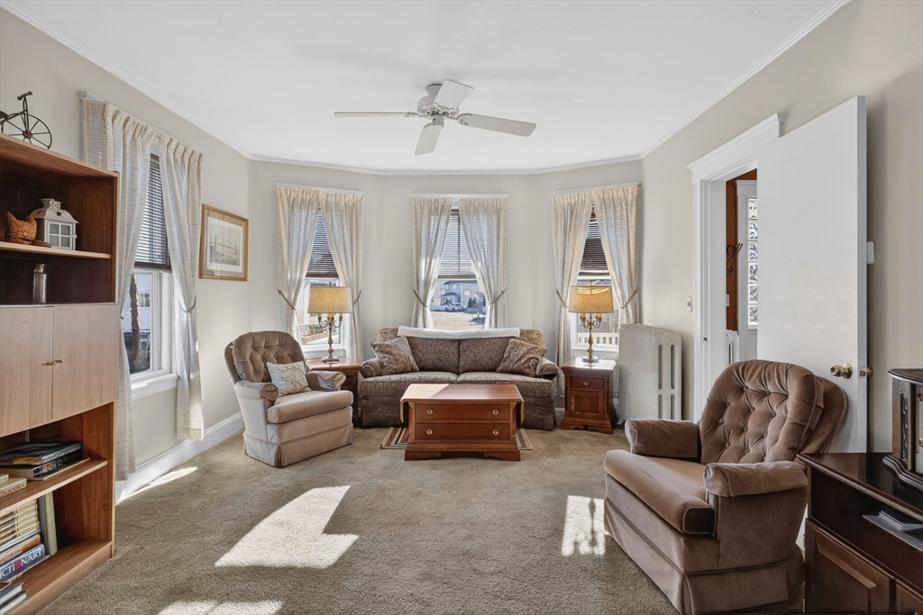 63 Marlboro Street Dedham, MA 02026 - Photo 15 of 40 a living room with furniture and a window