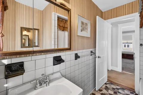 a view of a chairs and table in the room