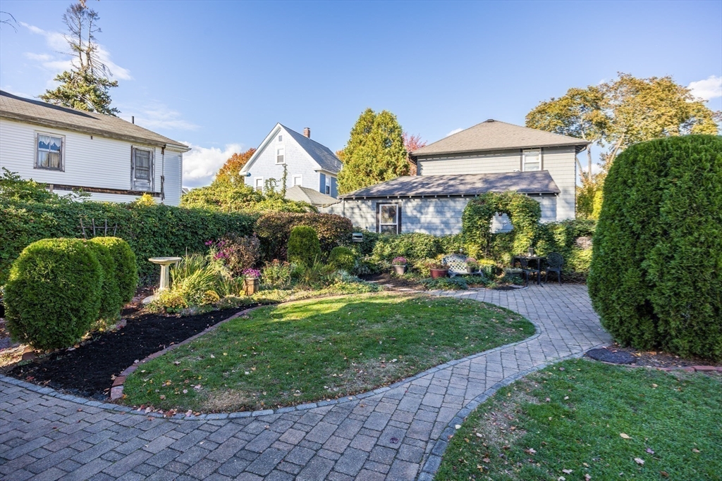 63 Marlboro Street Dedham, MA 02026 - Photo 7 of 40 a front view of a house with garden