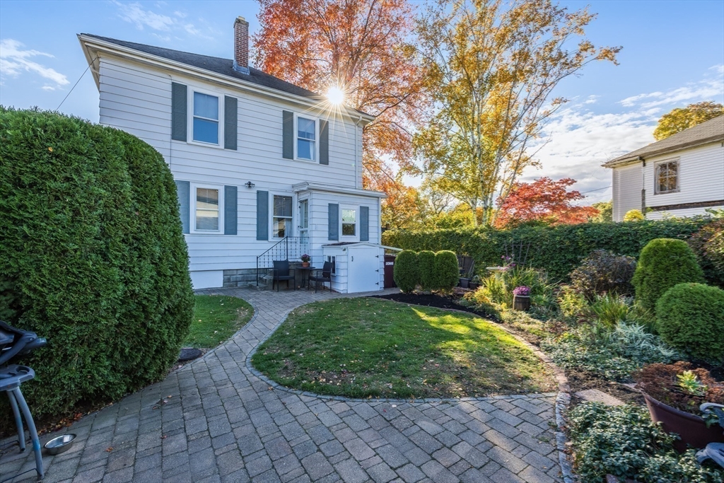 63 Marlboro Street Dedham, MA 02026 - Photo 8 of 40 a front view of a house with garden