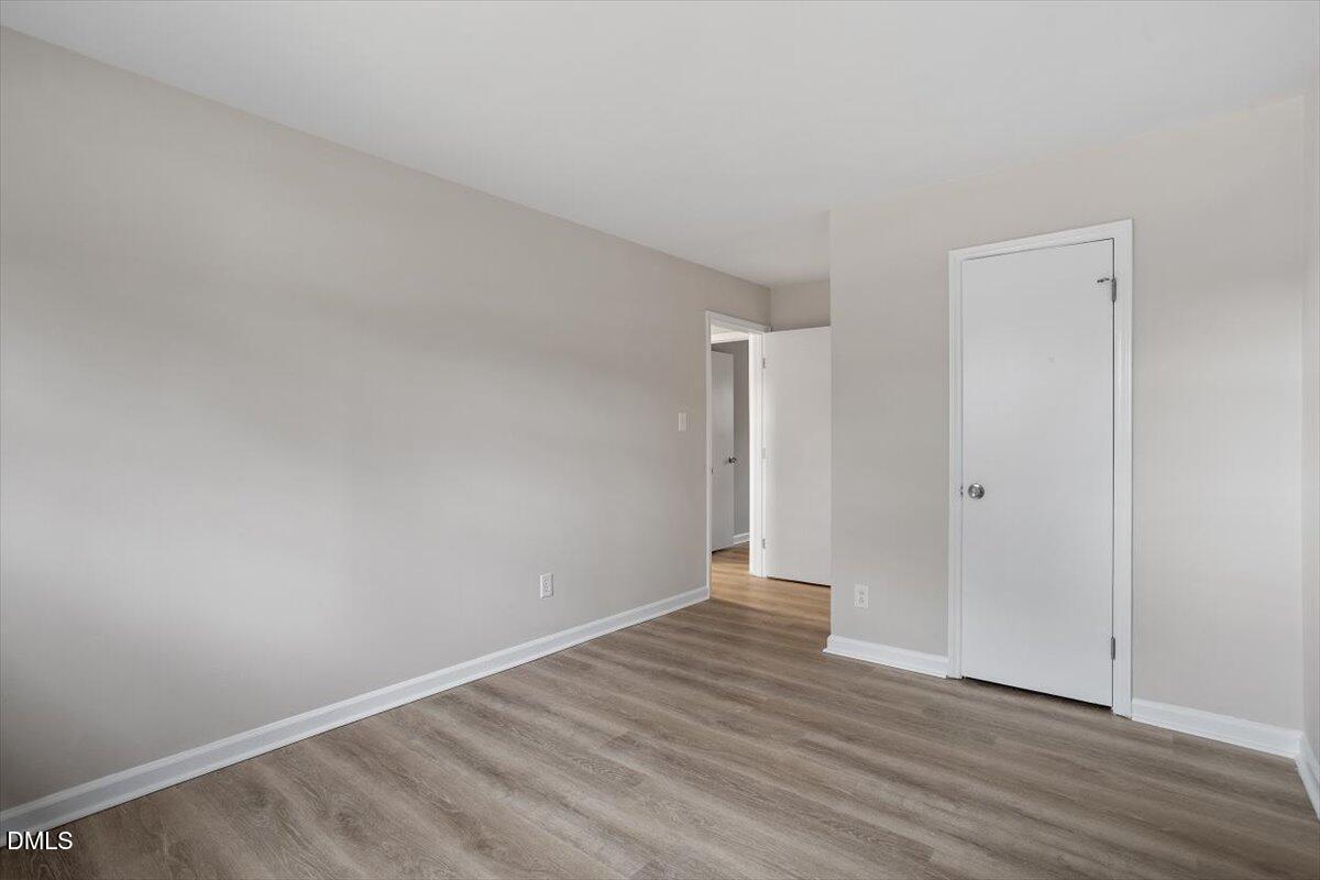 3306 Prudence Street Durham, NC 27704 - Photo 21 of 22 a view of an empty room with wooden floor