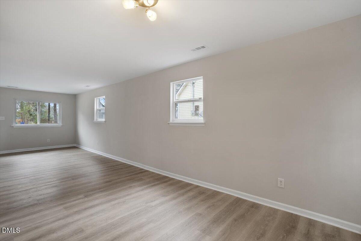 3306 Prudence Street Durham, NC 27704 - Photo 5 of 22 an empty room with windows