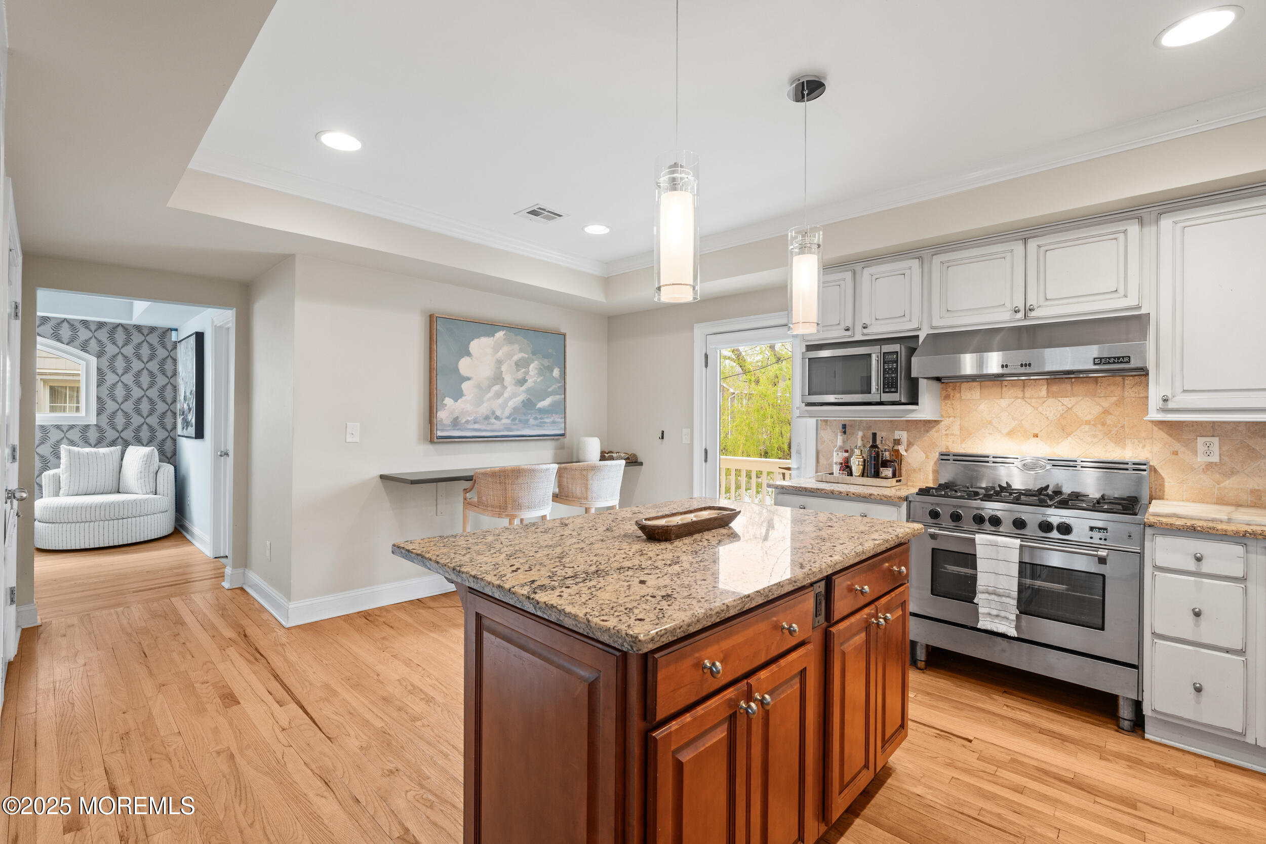 5 Shrewsbury Way Sea Bright, NJ 07760 - Photo 21 of 59 a kitchen with granite countertop kitchen island wooden cabinets and stainless steel appliances