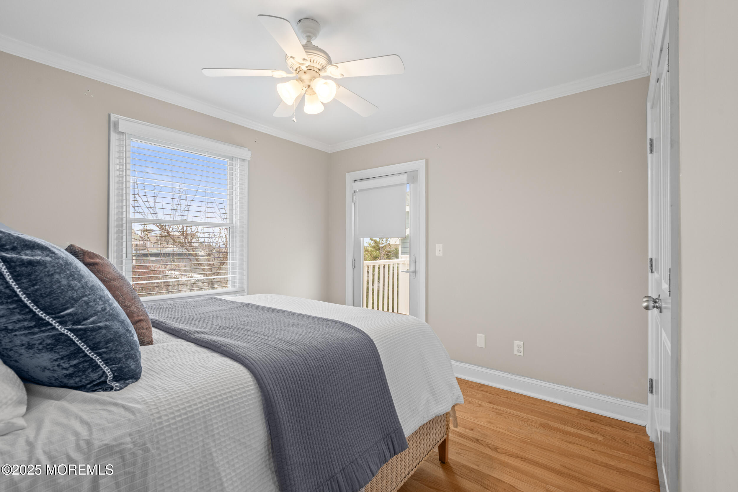 5 Shrewsbury Way Sea Bright, NJ 07760 - Photo 36 of 59 a bedroom with a large bed and a chandelier