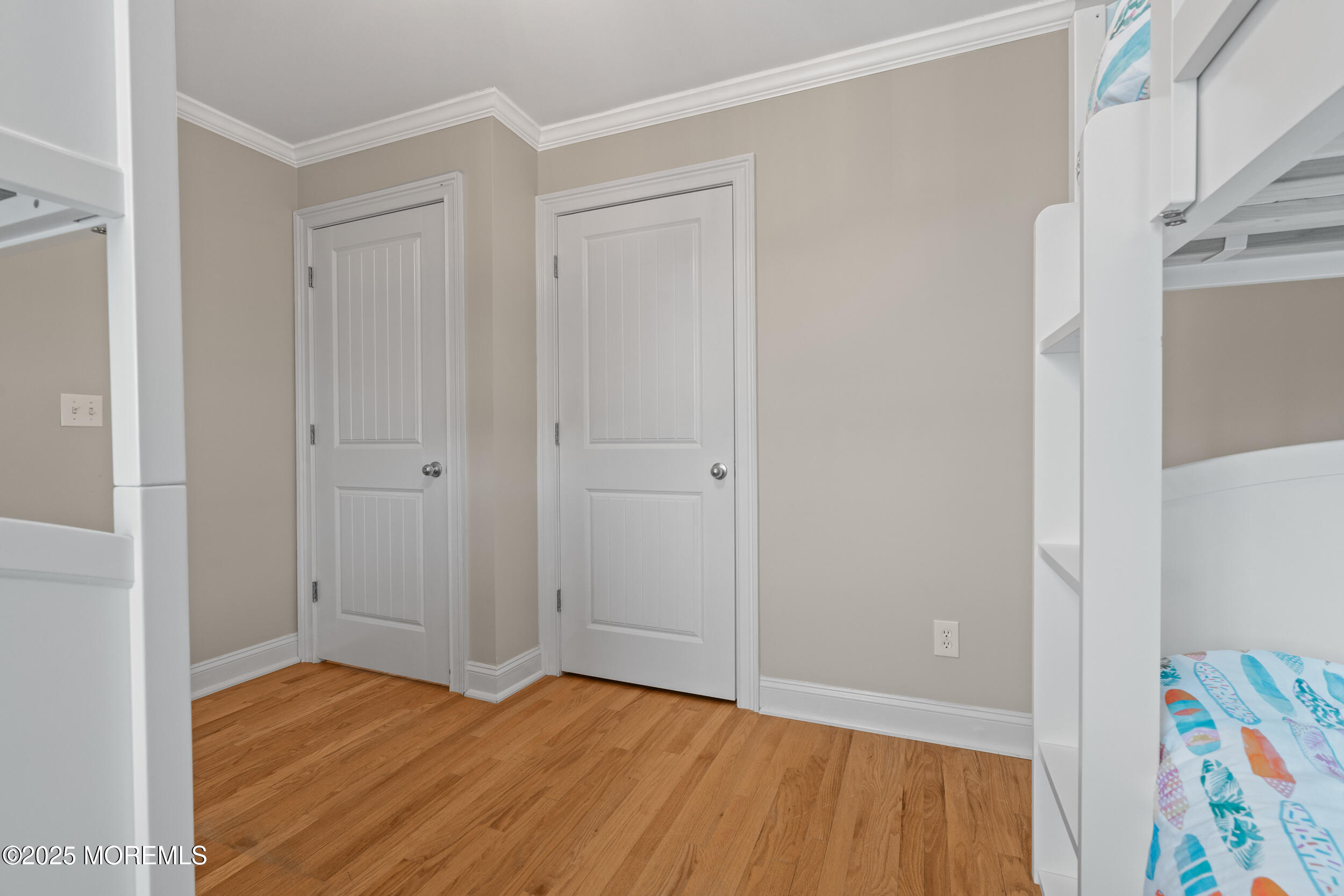 5 Shrewsbury Way Sea Bright, NJ 07760 - Photo 38 of 59 a view of an empty room with wooden floor and closet