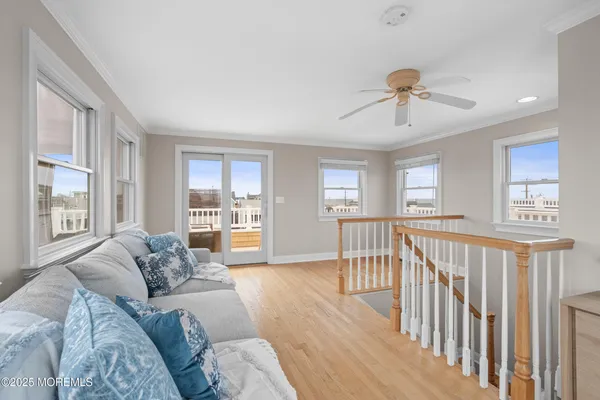 a bedroom with a bed and a couch with window