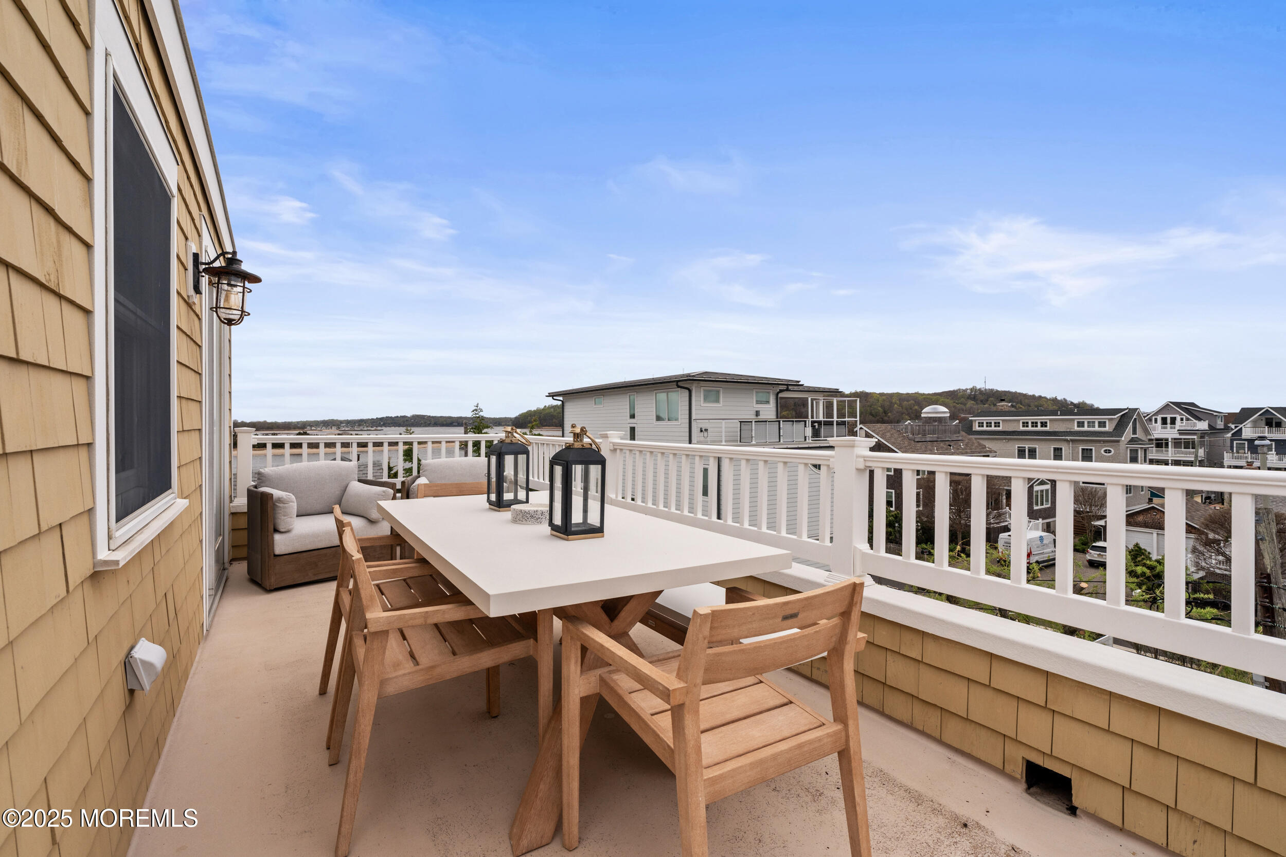 5 Shrewsbury Way Sea Bright, NJ 07760 - Photo 44 of 59 a view of a balcony with table and chairs