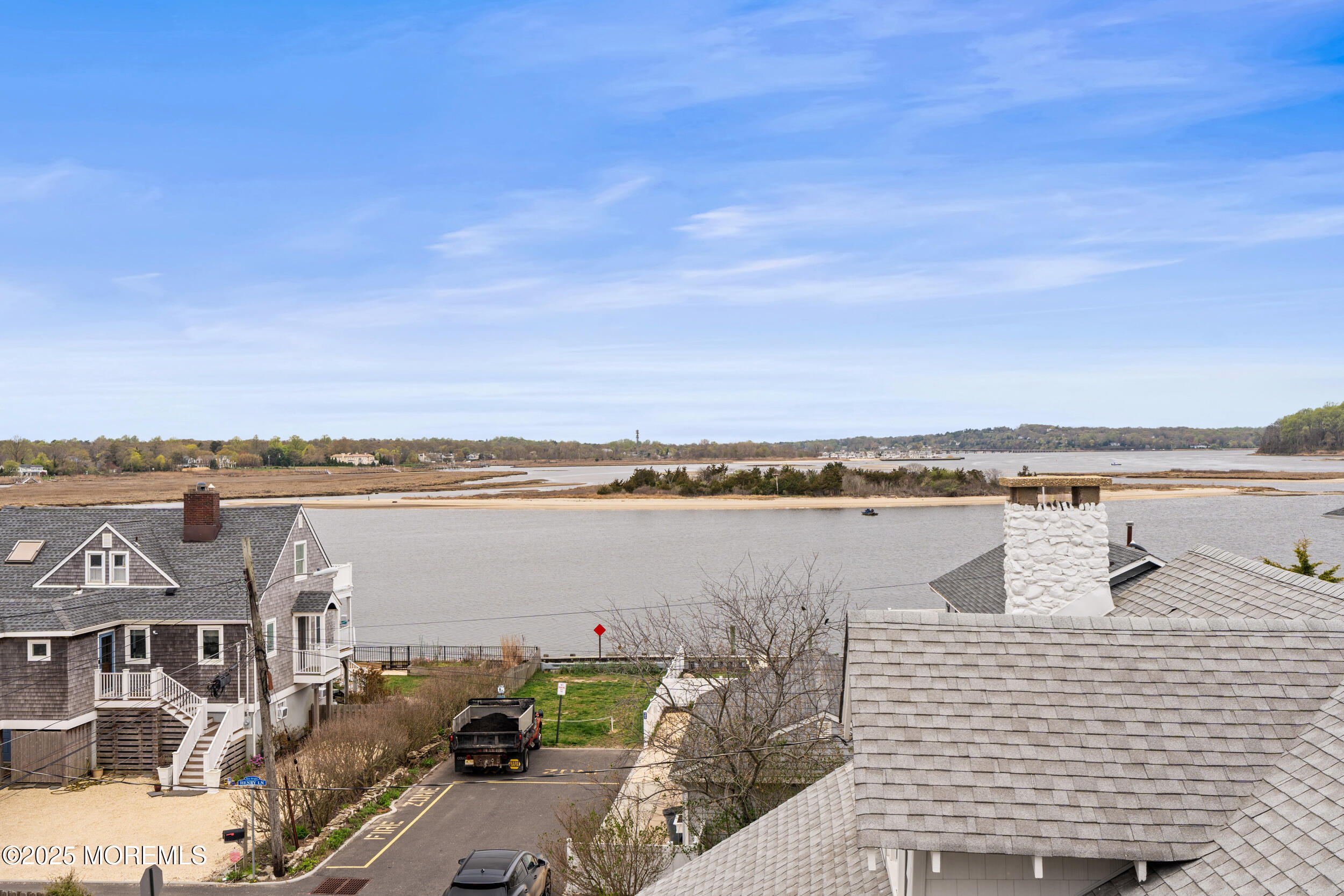 5 Shrewsbury Way Sea Bright, NJ 07760 - Photo 48 of 59 a view of a lake with houses with outdoor seating
