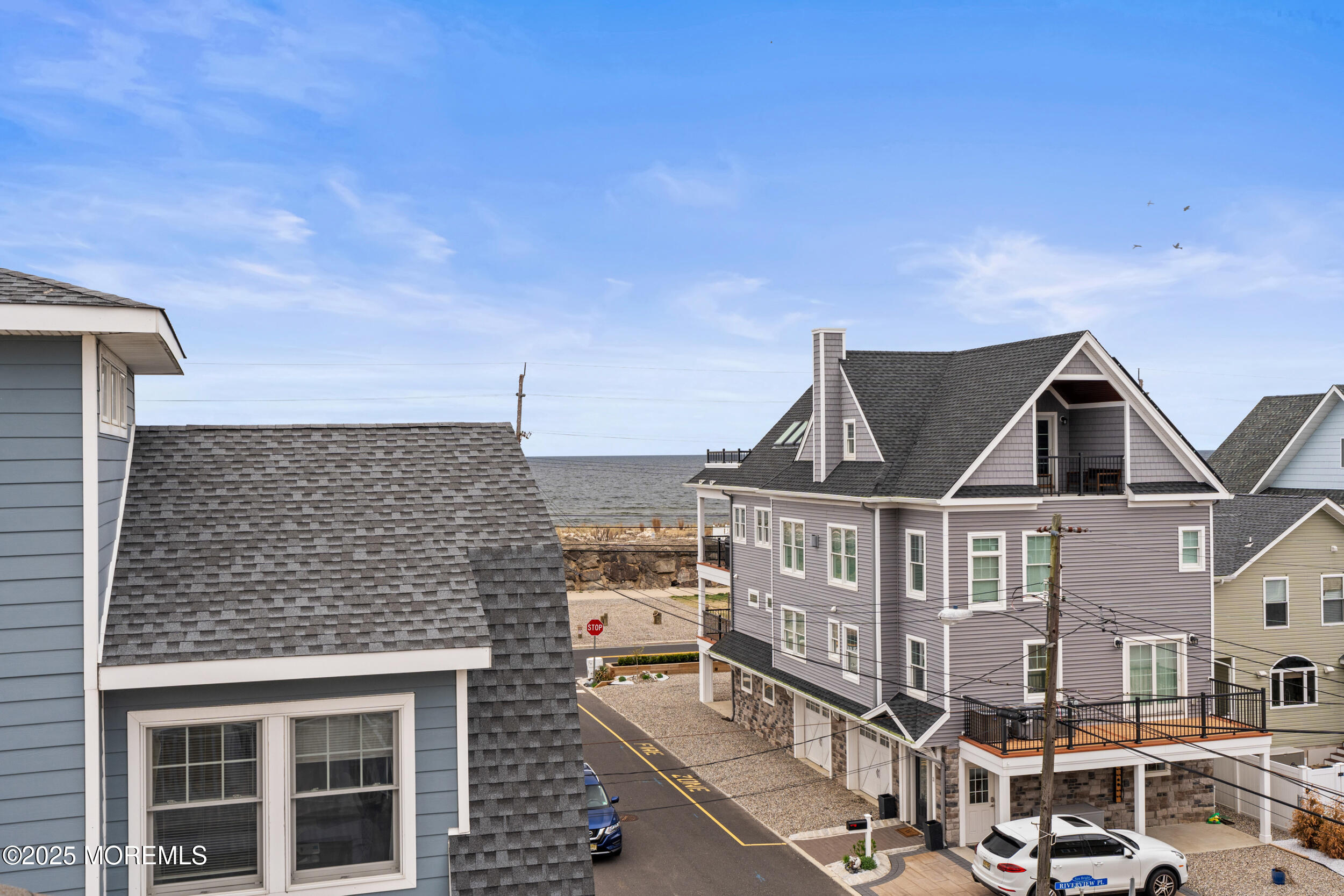 5 Shrewsbury Way Sea Bright, NJ 07760 - Photo 49 of 59 a front view of a residential apartment building with glass windows