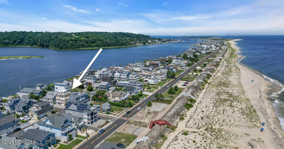 5 Shrewsbury Way Sea Bright, NJ 07760 - Photo 6 of 59 a view of a lake with a yard