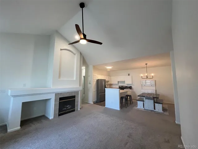 a view of a livingroom with furniture and a fireplace