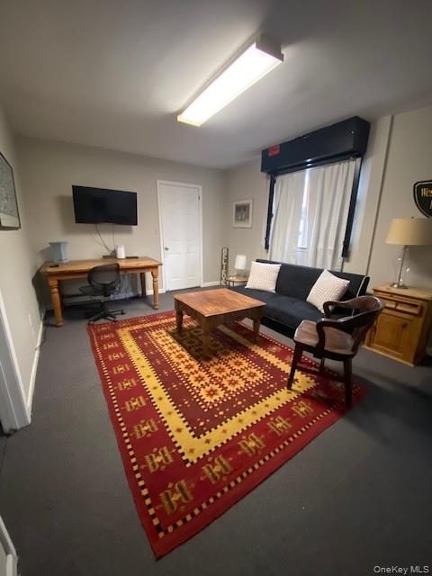 127 Indian Hill Road Bedford, NY 10506 - Photo 3 of 6 a bedroom with a bed and flat screen tv