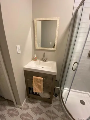 a bathroom with a sink a mirror and a vanity