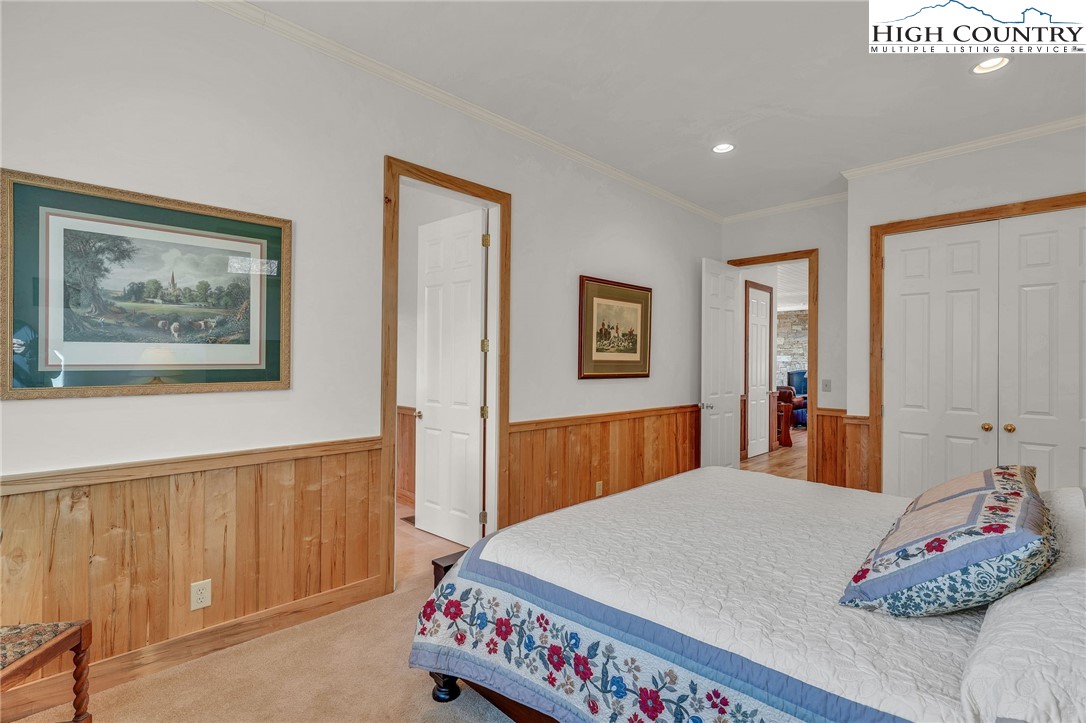 933 Thunder Ridge Lane Lenoir, NC 28645 - Photo 35 of 45 a bedroom with a large bed and a dresser