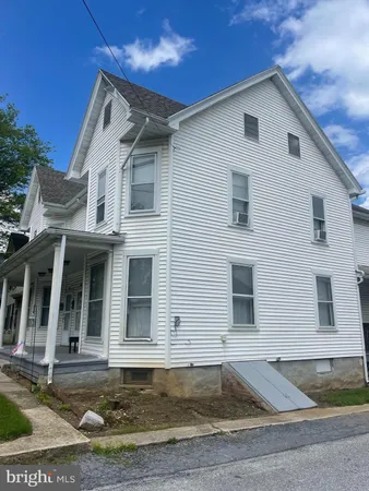 a front view of a house with yard