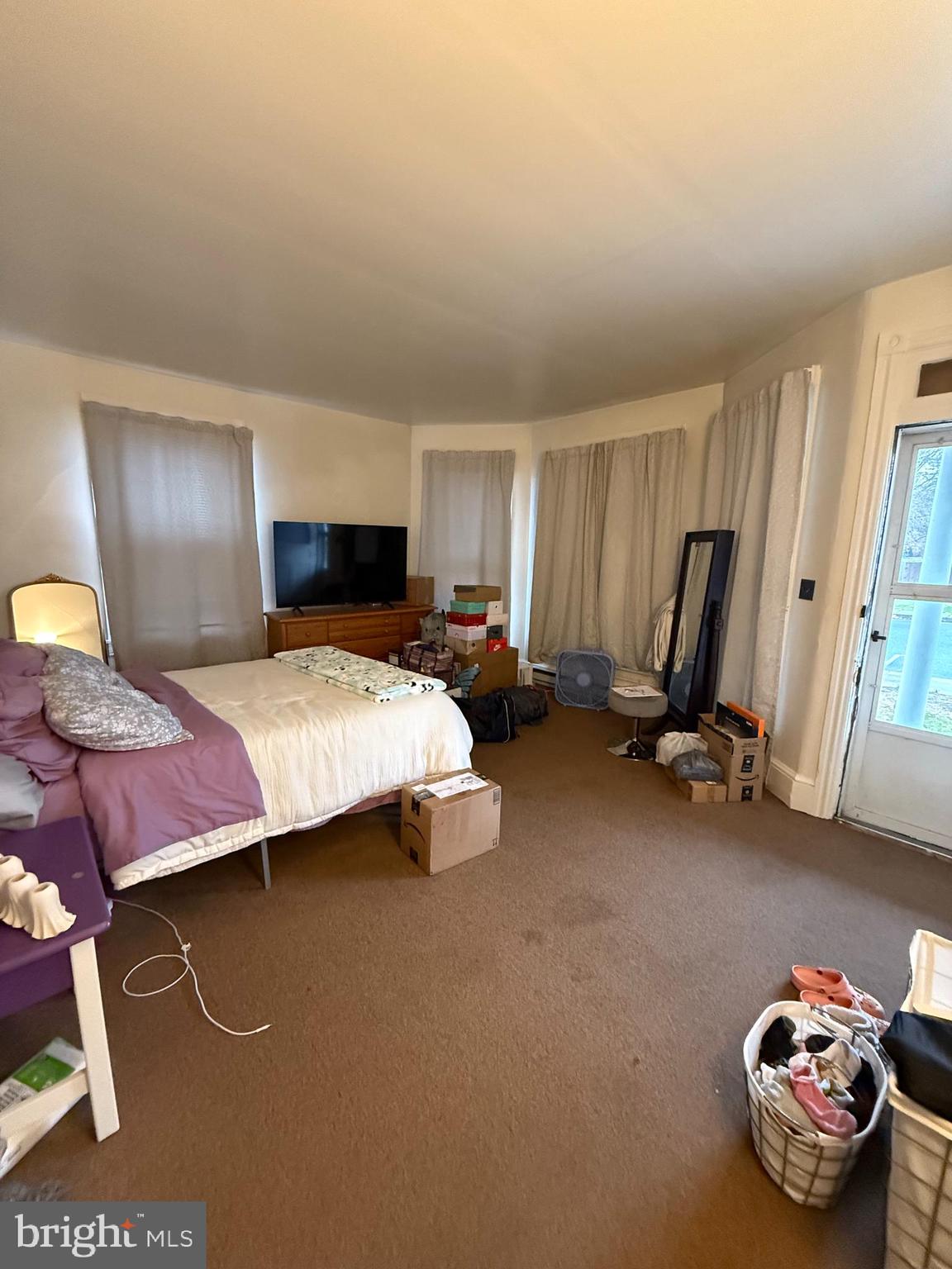 17 Cumberland Avenue Shippensburg, PA 17257 - Photo 5 of 12 a bedroom with a bed and a chair