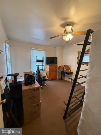 a view of a livingroom with furniture and a flat screen tv