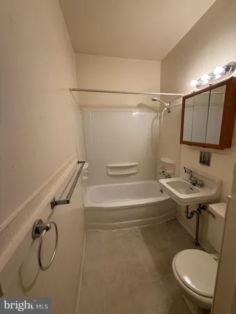 a bathroom with a sink a mirror and a shower