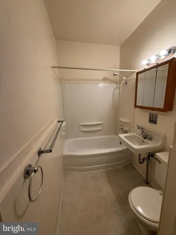 a bathroom with a sink a mirror and a shower