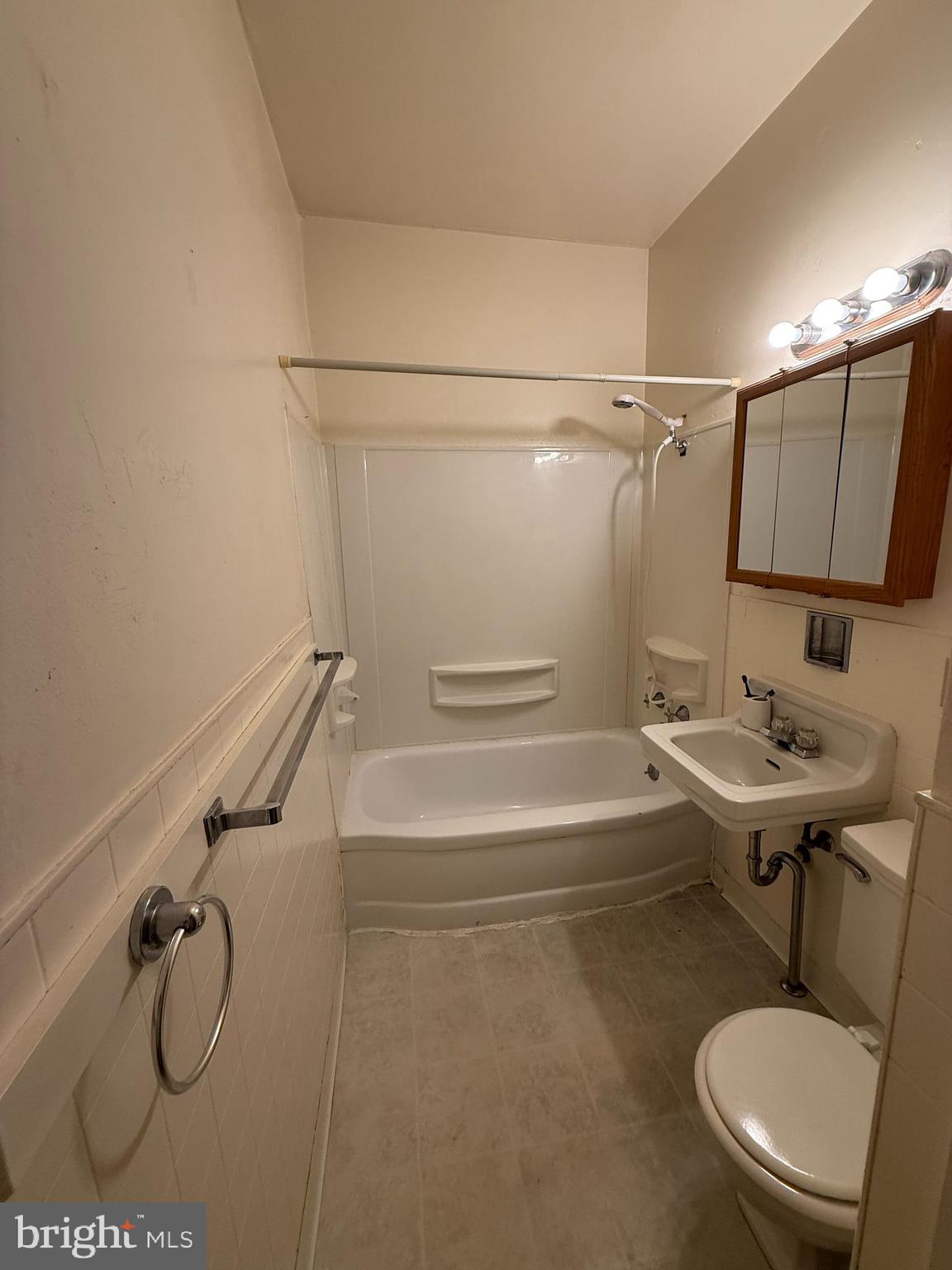 17 Cumberland Avenue Shippensburg, PA 17257 - Photo 8 of 12 a bathroom with a sink a mirror and a shower