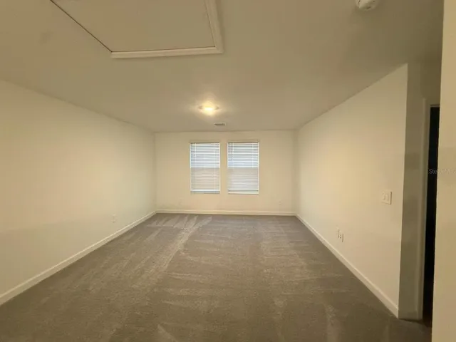 a kitchen that has a sink and a stove in it