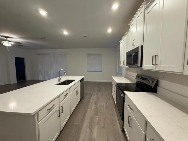 a bathroom with a toilet sink and a mirror