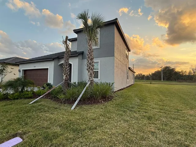 a view of a house with a yard