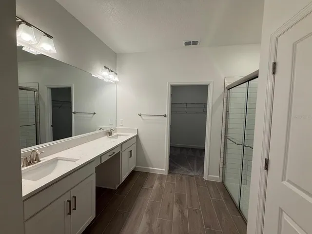 a room with a sink vanity and dryer