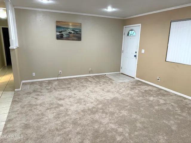 an empty room with a bathroom