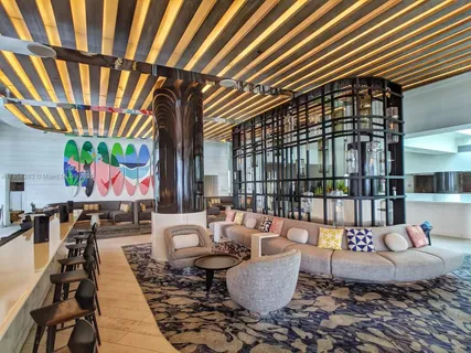 a living room with furniture a fireplace and a table