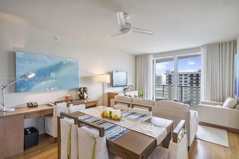 a bedroom with a large bed and a large window