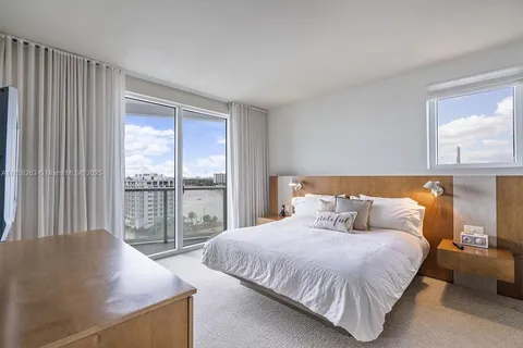 a kitchen with granite countertop stainless steel appliances and wooden cabinets
