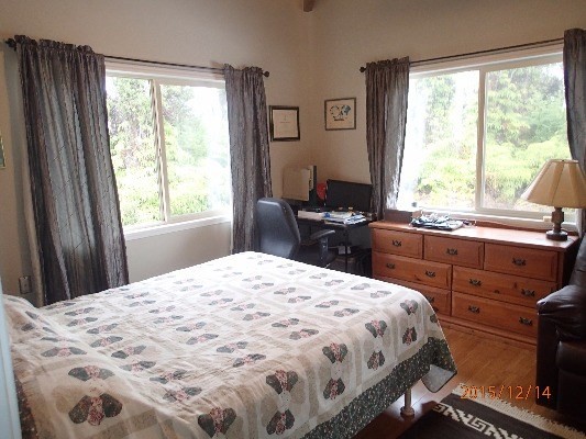 11-2808 Kaleponi Road Mountain View, HI 96771 - Photo 13 of 25 a bedroom with a bed and a window