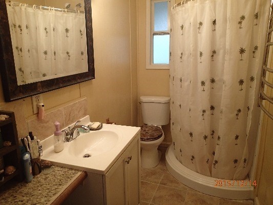 11-2808 Kaleponi Road Mountain View, HI 96771 - Photo 23 of 25 a bathroom with a sink and mirror