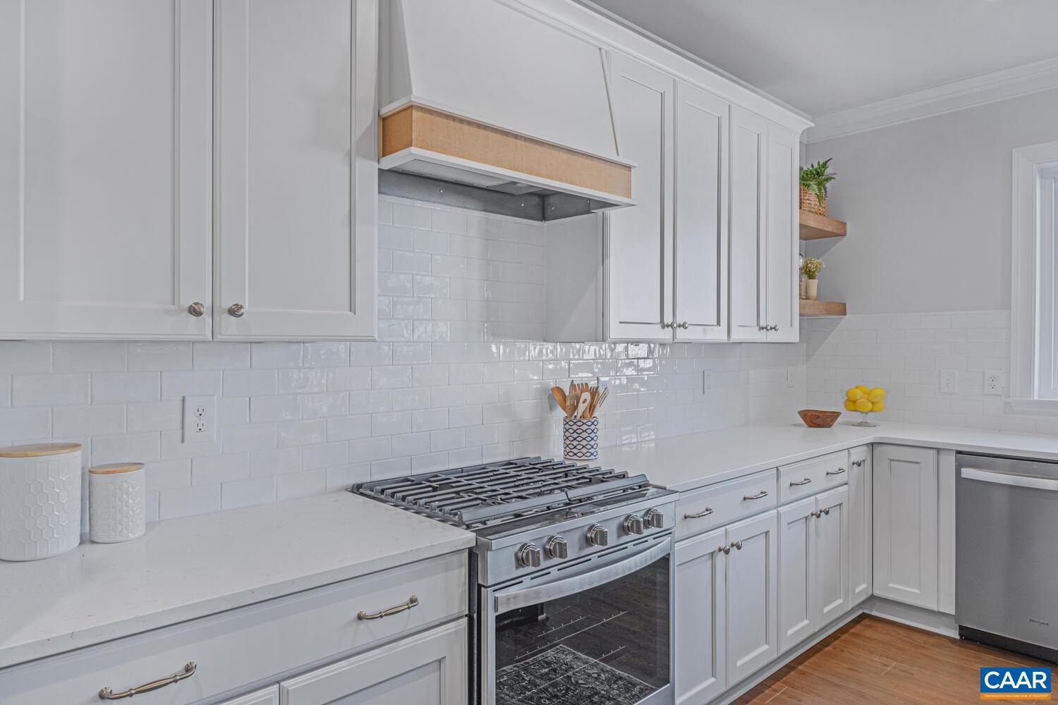 1731 Fowler Street Charlottesville, VA 22901 - Photo 18 of 45 a kitchen with white cabinets and white appliances