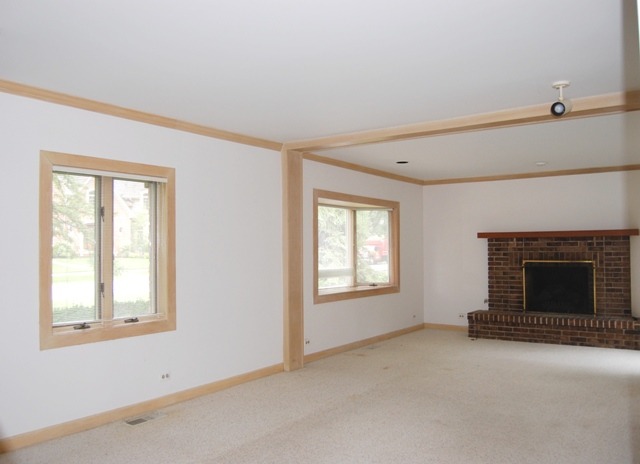 2160 Dehne Road Northbrook, IL 60062 - Photo 4 of 15 an empty room with windows and fireplace