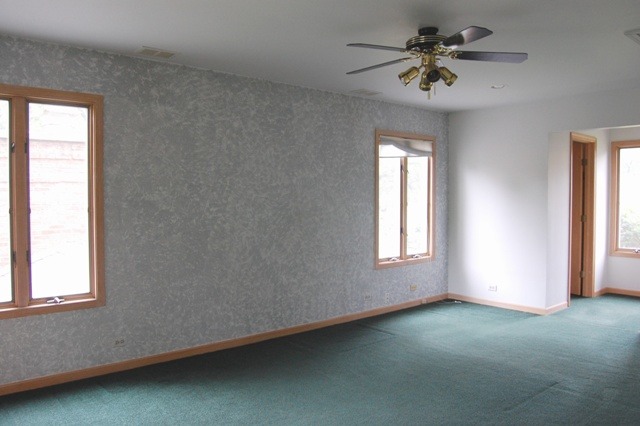 2160 Dehne Road Northbrook, IL 60062 - Photo 7 of 15 an empty room with a window and a fan
