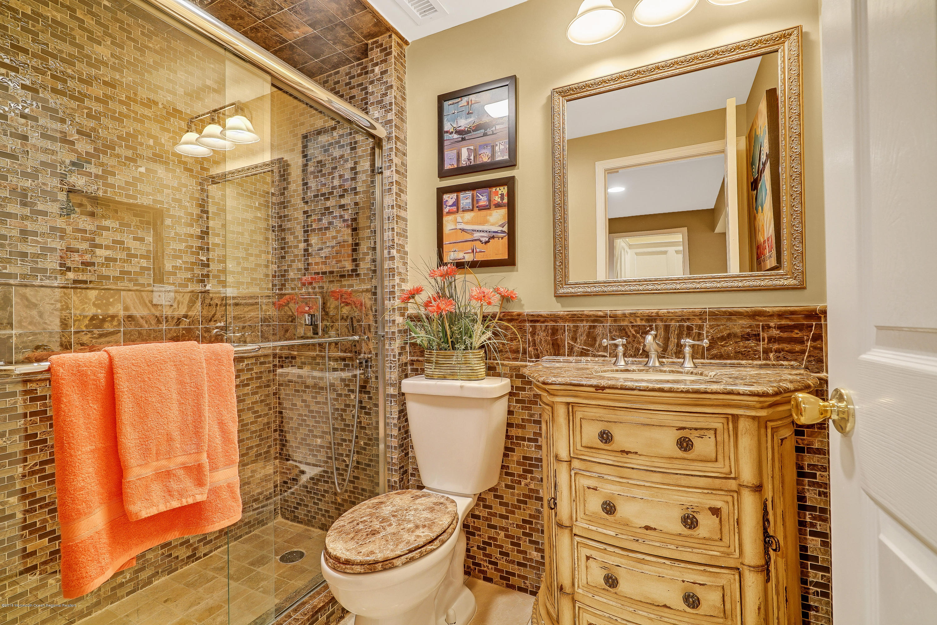 18 Mariners Bend Brielle, NJ 08730 - Photo 24 of 31 a bathroom with a toilet a sink and a mirror