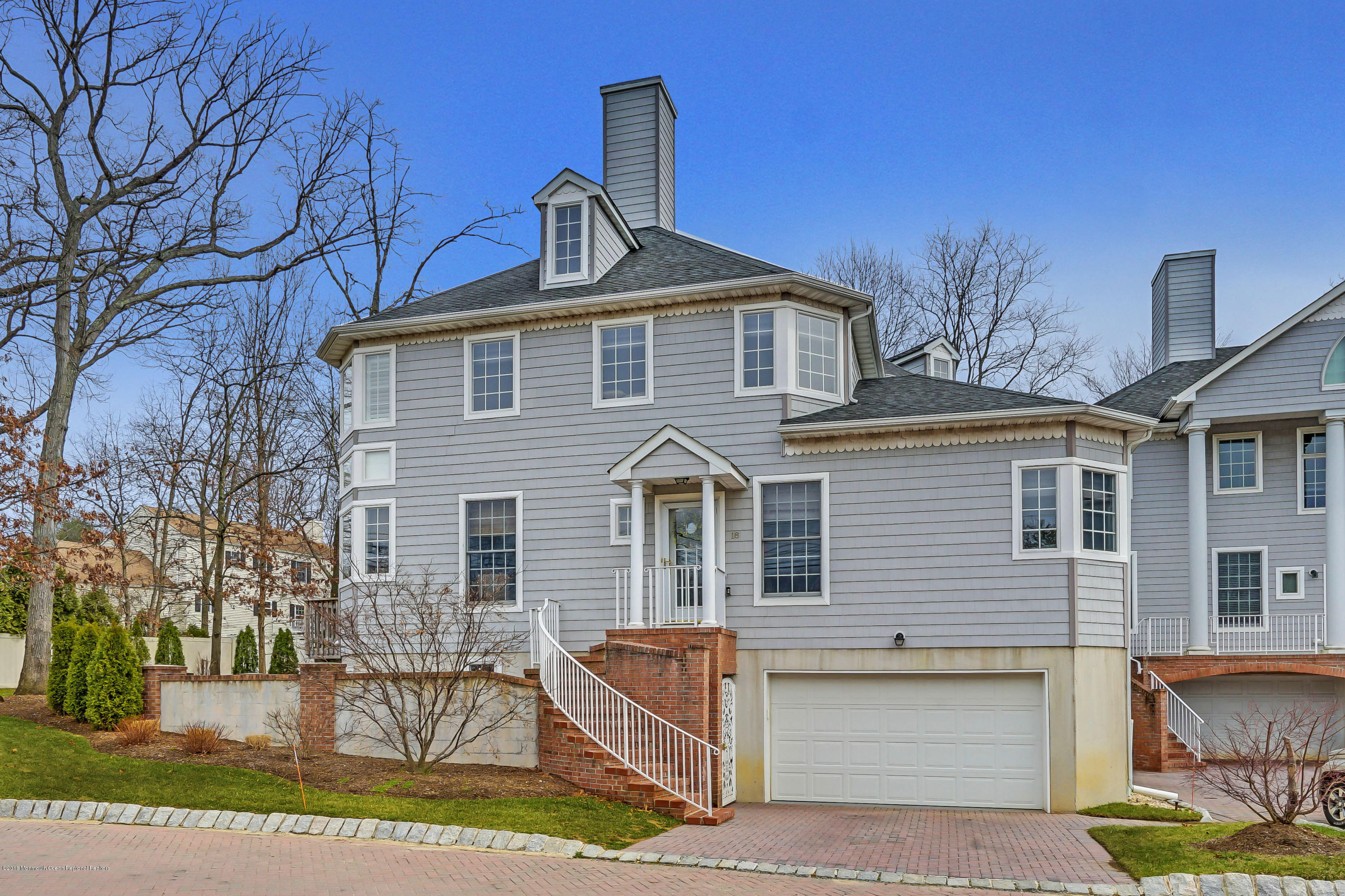 18 Mariners Bend Brielle, NJ 08730 - Photo 25 of 31 a front view of a house with garden