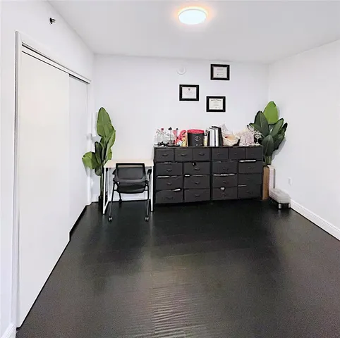 a bathroom with a double vanity sink toilet and shower